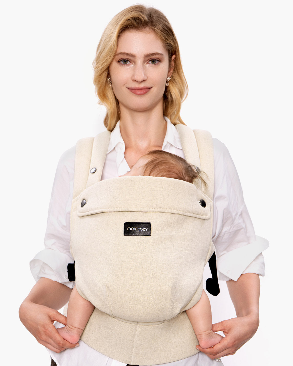 Momcozy PureHug baby carrier in beige, comfortable babywearing for mother and baby, promotes bonding.